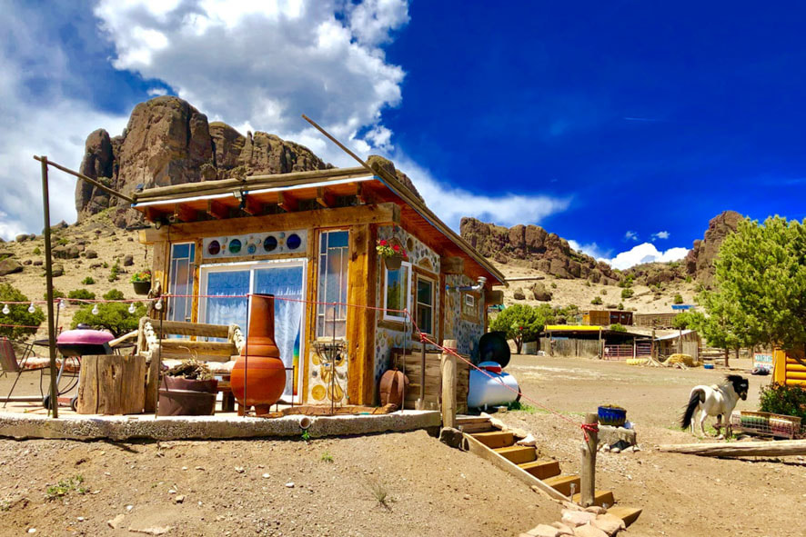 Charming tiny house with a mini-horse and scenic mountain backdrop